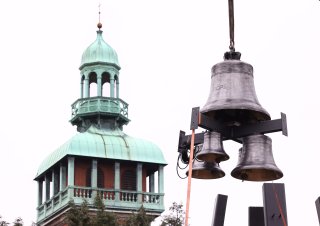 The Hope Bell is lifted into place